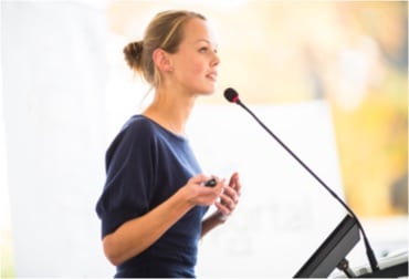 Woman speaking at a conference