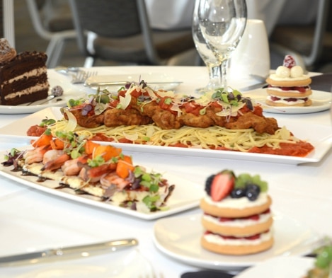 Family style chicken parmesan, bruschetta, iced cookies and chocolate cake