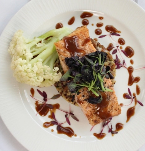 Grilled salmon over rice with a teriyaki drizzle